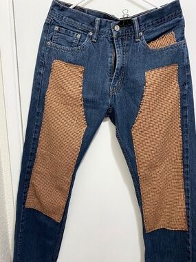 Levis 505  Size W 32 and L 30 Women’s Blue Jeans with patches.